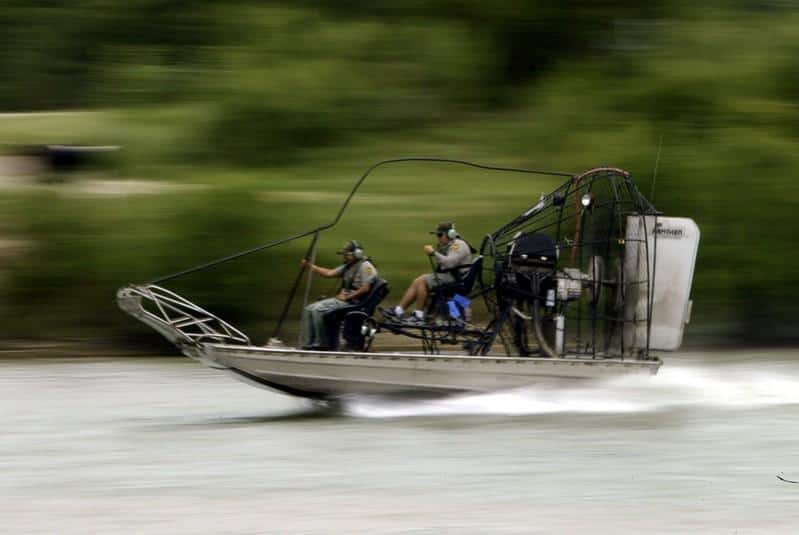 Baby's body recovered, three missing, after raft carrying migrants ...