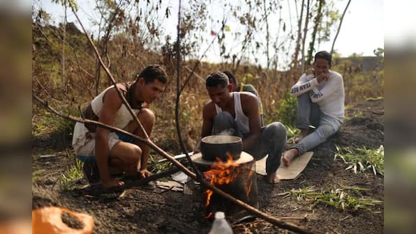Venezuela reopens border where migrants used trails to reach Brazil