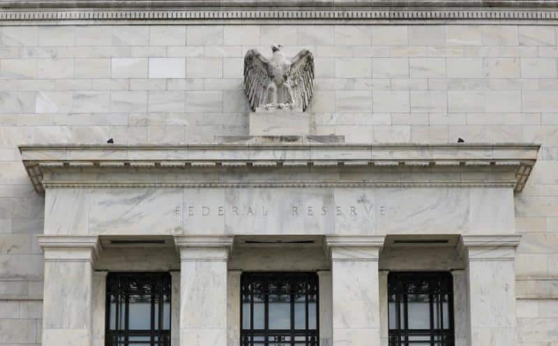 Fed officials see risks in weaker inflation expectations, trade row