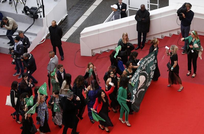 Clad in green film crew protest Argentina abortion law on Cannes red carpet