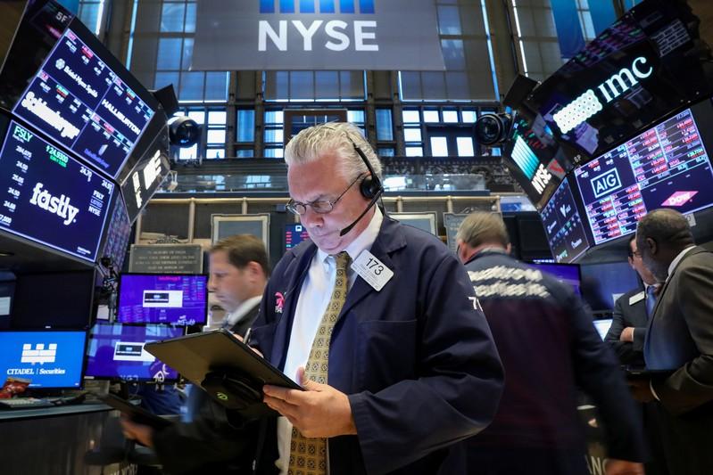 Wall Street tumbles over 1 on trade growth fears
