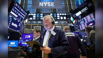 Wall St. clings to slight gains after Trump sparks U.S.-China trade hopes