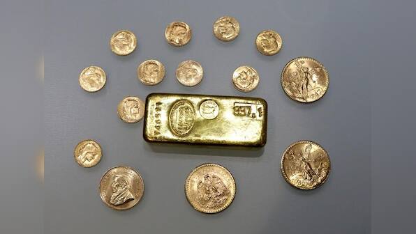 Gold eases as dollar bounces back from multi-week lows