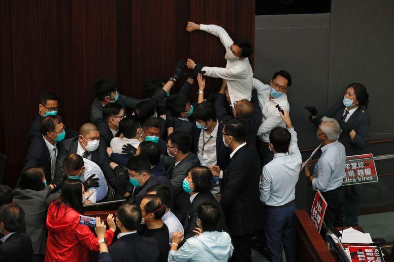 ProChina and democratic lawmakers scuffle in Hong Kong legislature