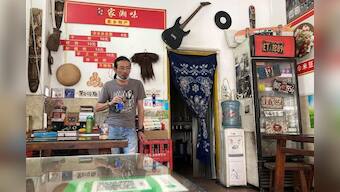 As China's factories feel economic blues, band of workers tell their story through rock music