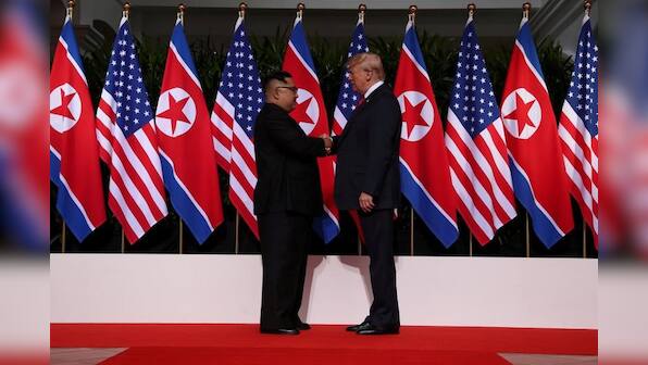 Trump in surprise summit move says he will halt Korea war games
