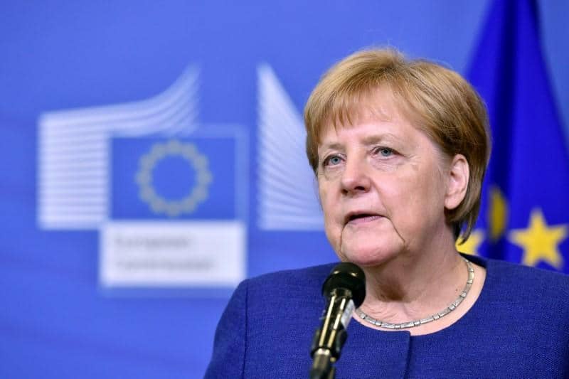 Hoping for EU help, Merkel talks migration with coalition partners