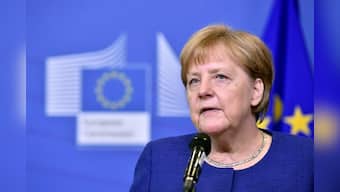 Hoping for EU help, Merkel talks migration with coalition partners