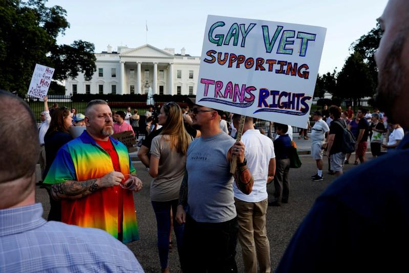 US court lets Trump transgender military ban stand orders new review