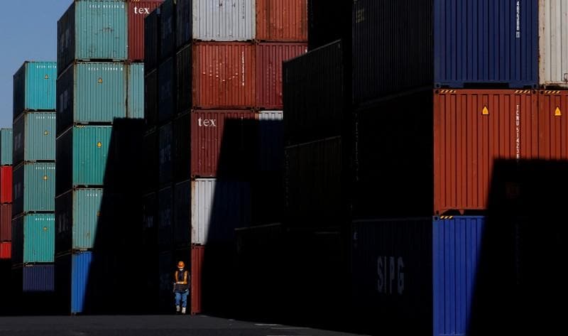 Japan exports slide for 6th month as trade troubles knock demand