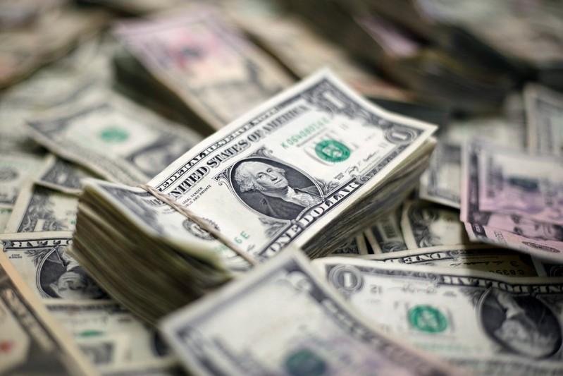 Dollar on defensive after Fed signals readiness to cut rates