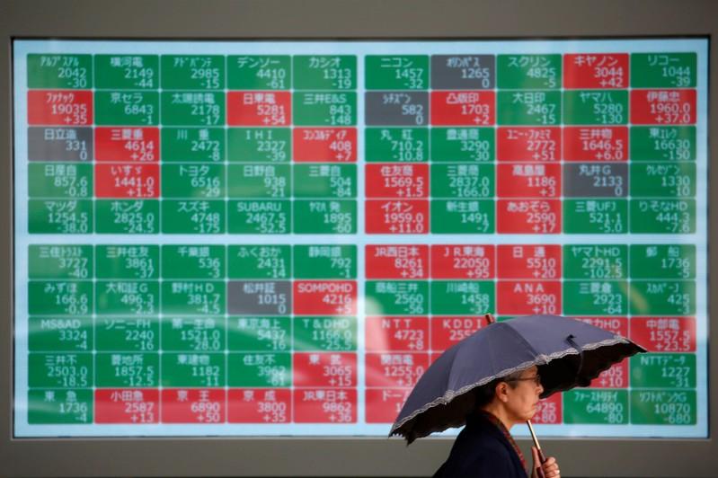 Asian stocks fail to catch Wall Sts Fed cheer as trade angst dominates