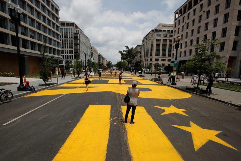 'Black Lives Matter' giant yellow mural painted on street near White House 'Black Lives Matter' giant yellow mural painted on street near White House
