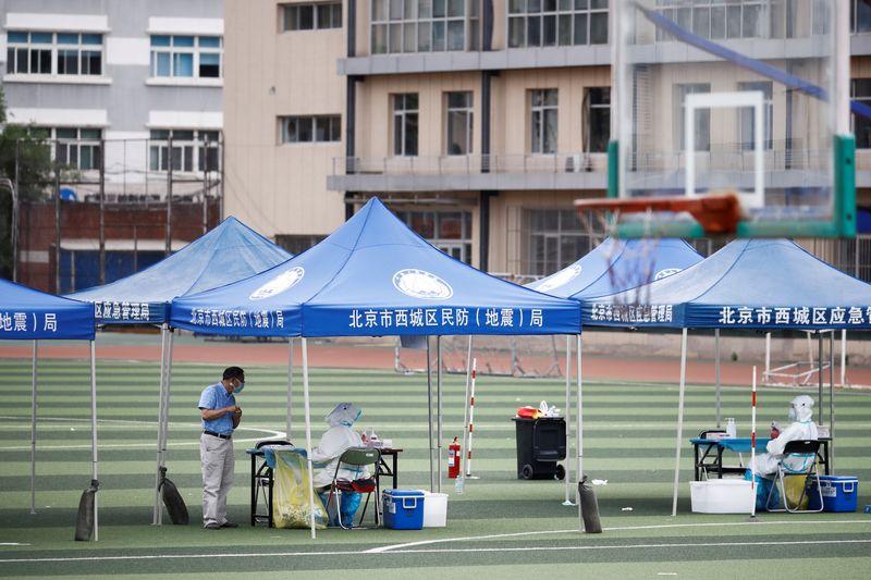 Crowds gather for coronavirus tests in Beijing amid new outbreak