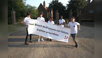 May wins support from divided UK government on Brexit plan