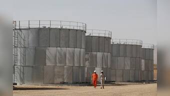 Oil steadies on OPEC cuts, but oversupply fears persist