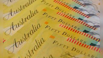 Australian dollar defies broader risk rally as RBA cut looms