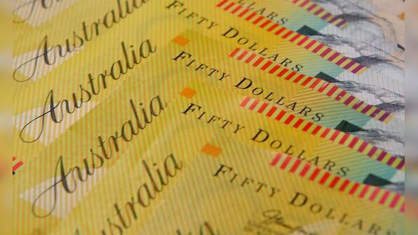 Australian dollar defies broader risk rally as RBA cut looms