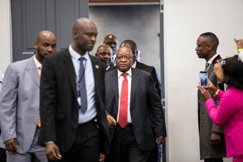 Defiant at inquiry South Africas Zuma denies breaking law with business brothers