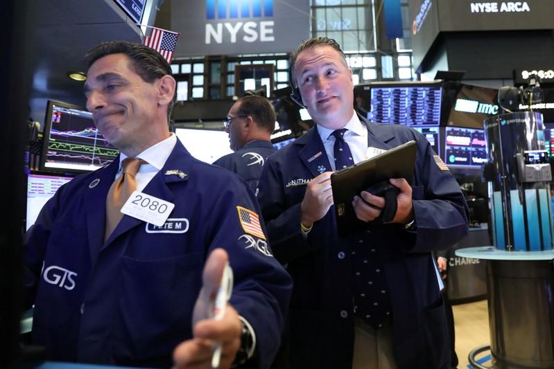 Earnings and trade optimism push Wall Street towards record high