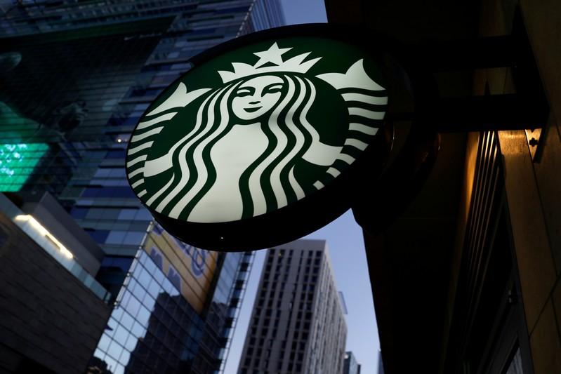 Starbucks raises profit view on US China demand shares near record