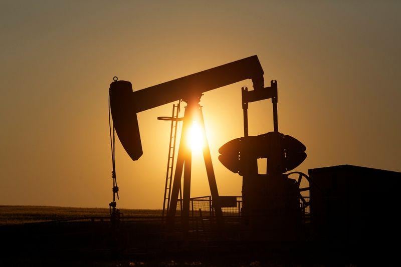 Oil rises on economic data but spike in US virus cases caps gains