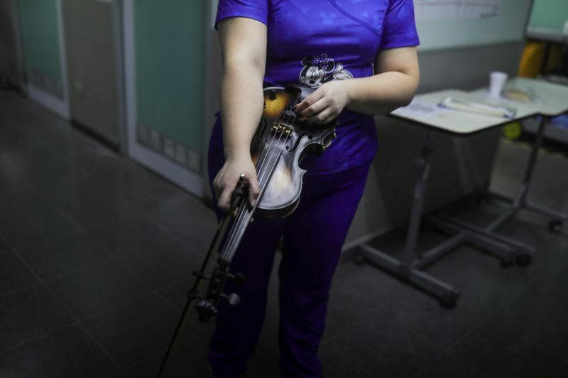 Strains of hope Chilean nurse serenades COVID19 patients with violin