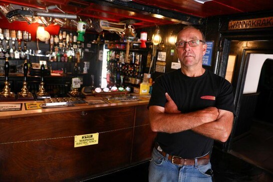 Shock and ale: electric fence keeps drinkers back from the bar in English pub Shock and ale: electric fence keeps drinkers back from the bar in English pub