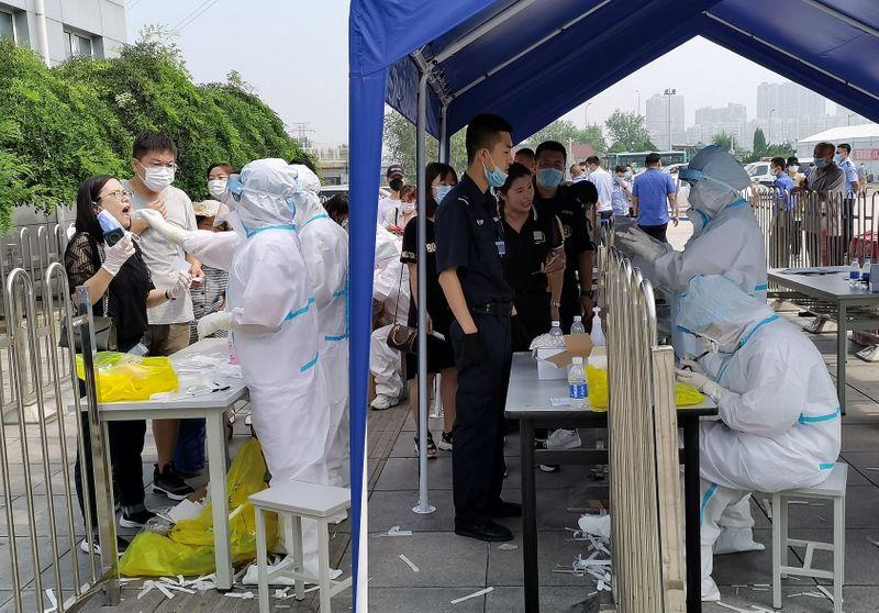 Mainland China reports 68 new coronavirus cases including 57 in Xinjiang