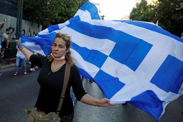 Greek police clash with protesters in rally against mandatory vaccinations