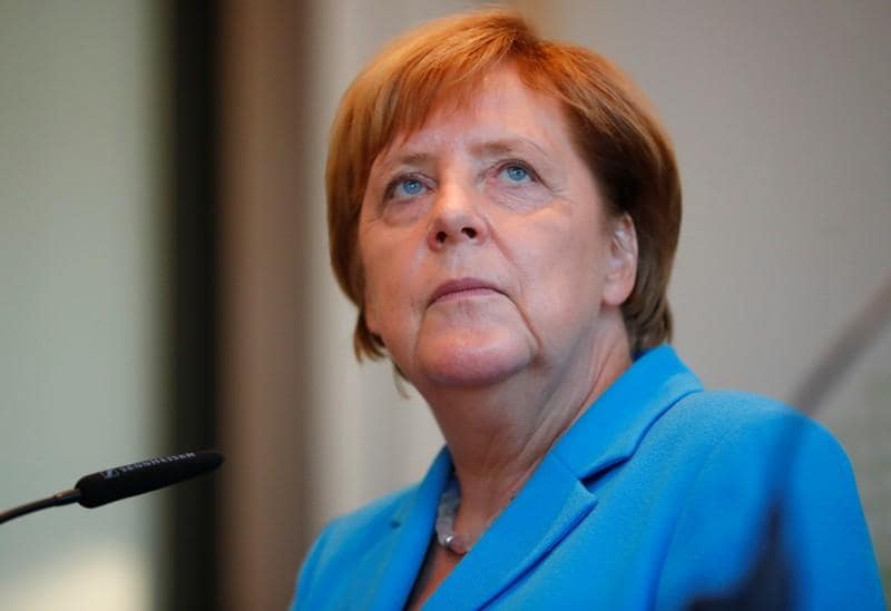 Facing Far Right Protest Merkel Pledges Action Over Failed Asylum