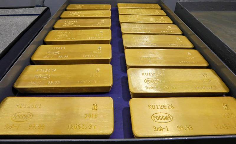Gold steadies, eyes weekly gain as dollar eases on weak U.S. data