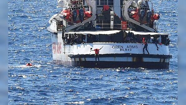 Migrants disembark Open Arms rescue ship on Italian island of Lampedusa