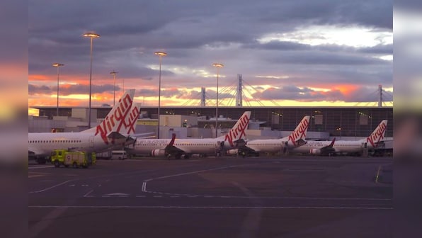 Virgin Australia to merge units, cut jobs as it swings to FY loss