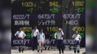 Bond yields near record lows, shares struggle on darkening global outlook