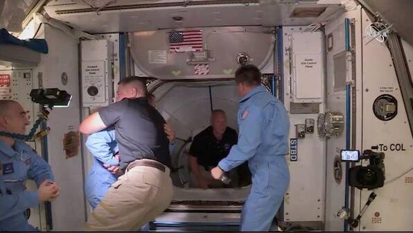 NASA astronauts splash down after journey home aboard SpaceX capsule