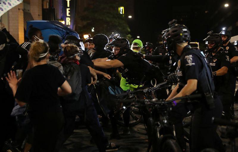 Protesters scuffle with police in Charlotte ahead of Republican convention