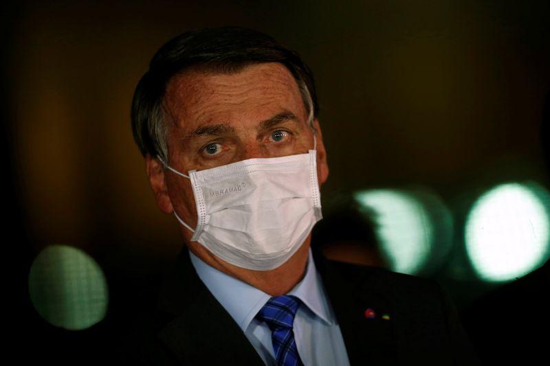 Brazils Bolsonaro says journalist wimps more likely to die of COVID19