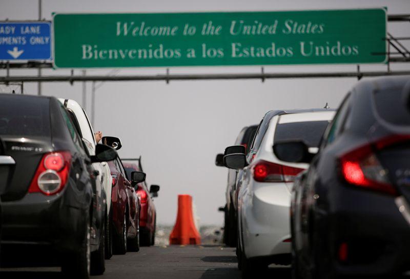 Long delays at USMexico border crossings after new travel restrictions