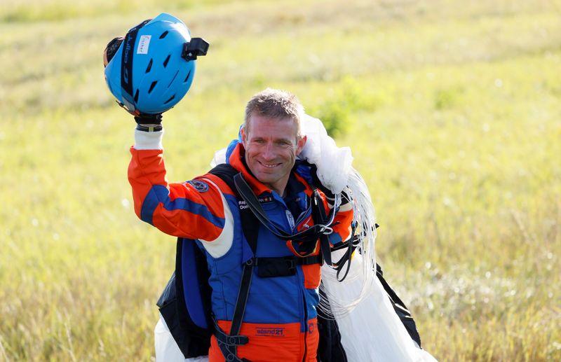 Parachutist makes worlds first jump from solarpowered plane