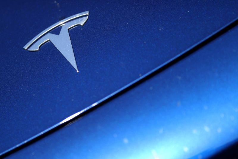 Tesla shares surge to record high leaving rivals behind