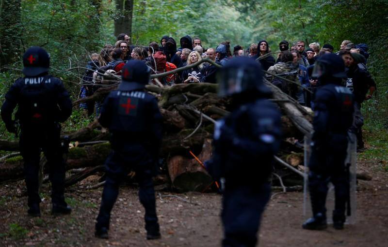 German police clear protestors from ancient forest marked for mining ...