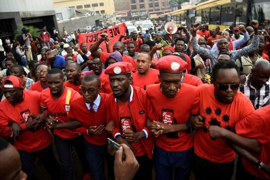 Police take Ugandan opposition leader Kyagulanyi home after he returns from abroad Police take Ugandan opposition leader Kyagulanyi home after he returns from abroad