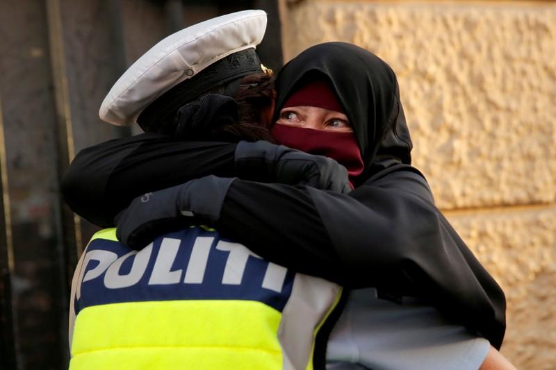 Danish police investigate officer who hugged niqabwearing protester