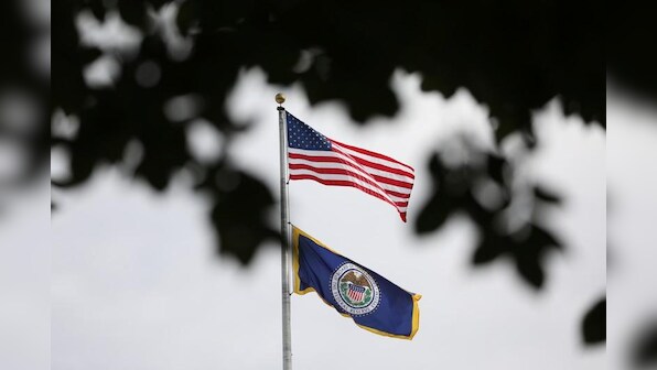 Fed raises rates, sees at least three more years of economic growth