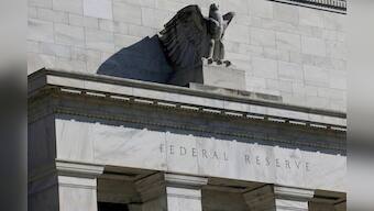 Fed cuts rates again, gives mixed signals for next move