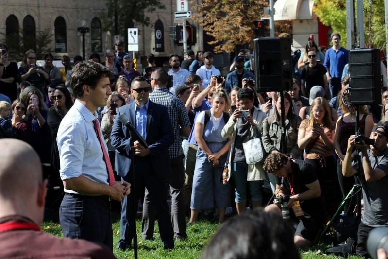 Canadas Trudeau pledges assault rifle ban pivots campaign amid blackface scandal