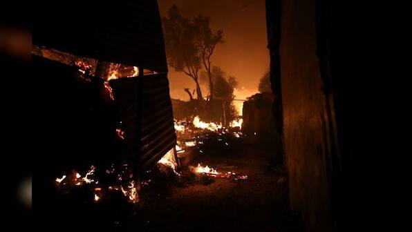 Thousands homeless after fire guts migrant camp on Greek island