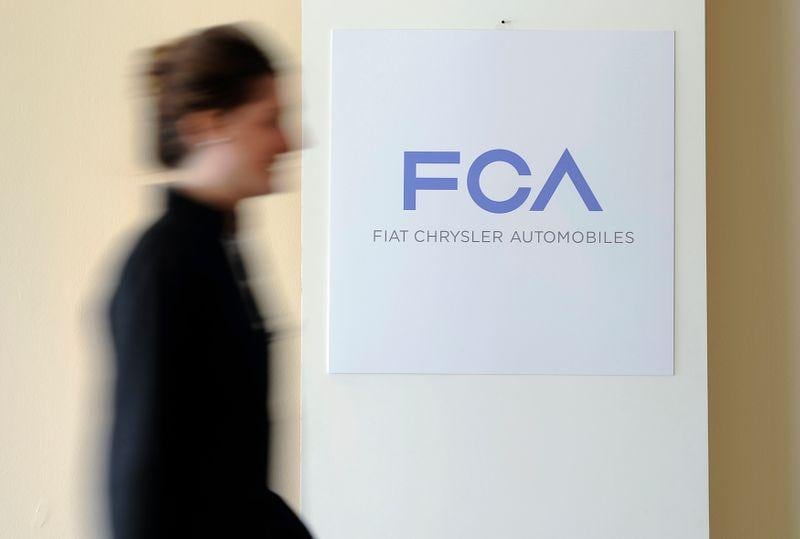 Fiat Chrysler Peugeot maker PSA amend merger terms to conserve cash