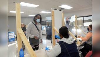 Voters line up as some U.S. states open early voting; Trump, Biden head to Minnesota